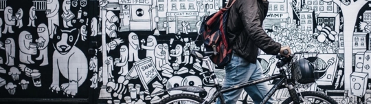man walking with his bicycle