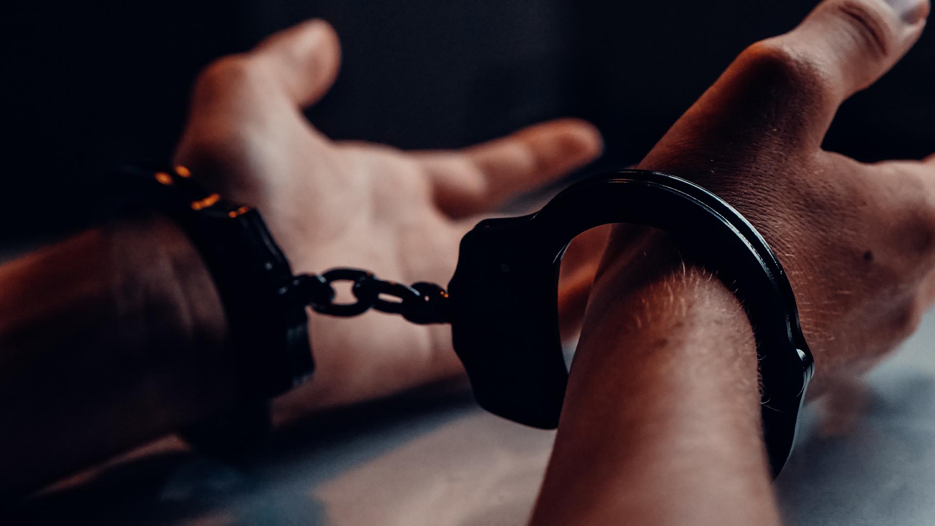 wrists in handcuffs